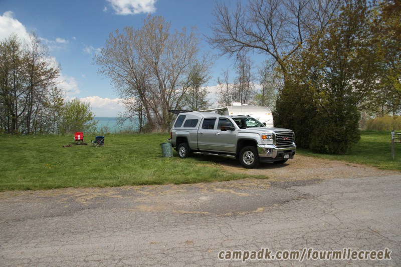 Campsite Photo of Site 232 at Four Mile Creek State Park, New York - Looking at Site from Road Sign Visible