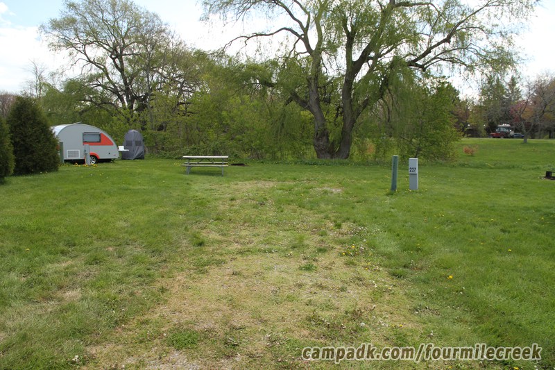 Campsite Photo of Site 227 at Four Mile Creek State Park, New York - Looking at Site from Road Sign Visible