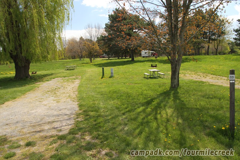 Campsite Photo of Site 221 at Four Mile Creek State Park, New York - Looking at Site from Road Sign Visible