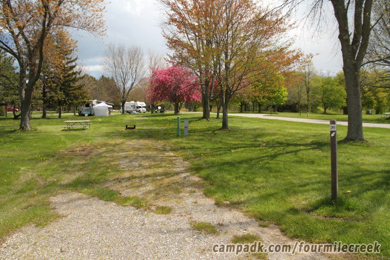 Campsite Photo of Site 201 at Four Mile Creek State Park, New York - Looking at Site from Road Sign Visible