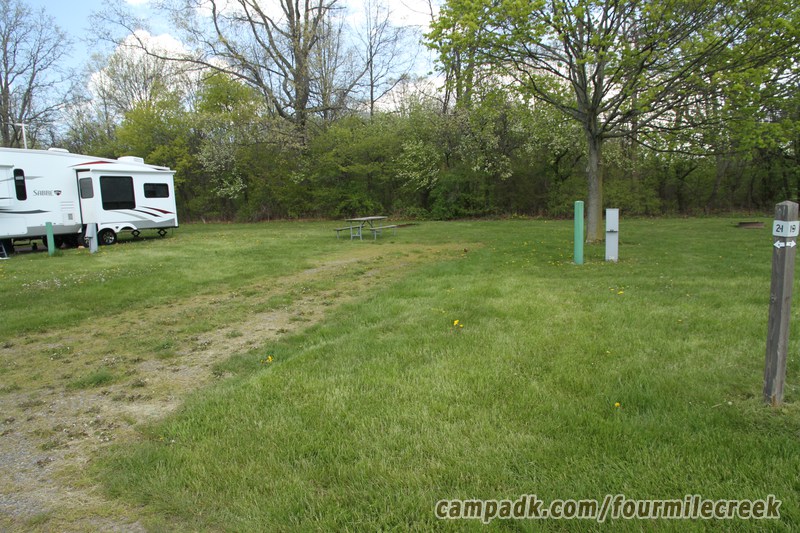 Campsite Photo of Site 21 at Four Mile Creek State Park, New York - Looking at Site from Road Sign Visible