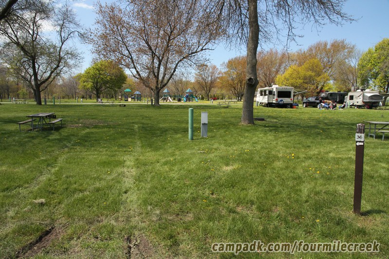 Campsite Photo of Site 36 at Four Mile Creek State Park, New York - Looking at Site from Road Sign Visible