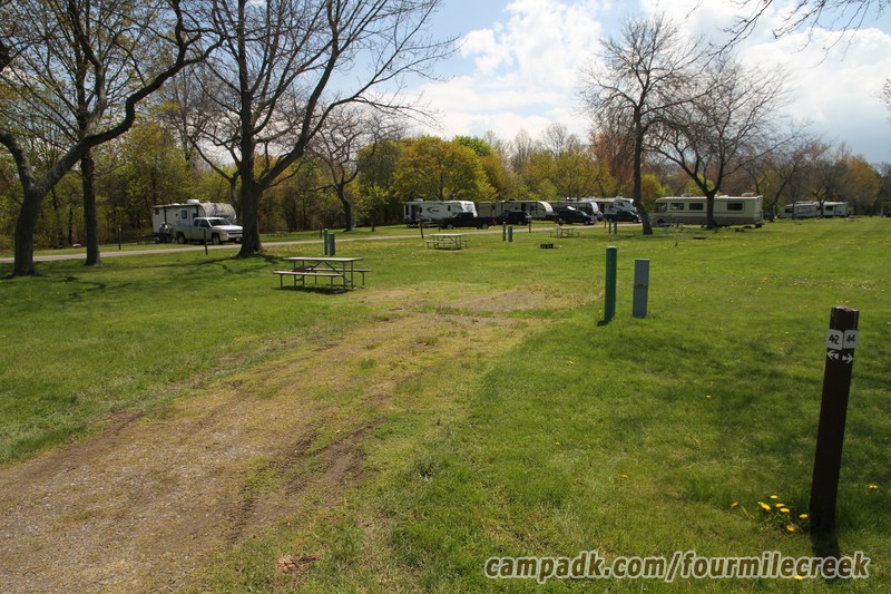 Campsite Photo of Site 42 at Four Mile Creek State Park, New York - Looking at Site from Road Sign Visible