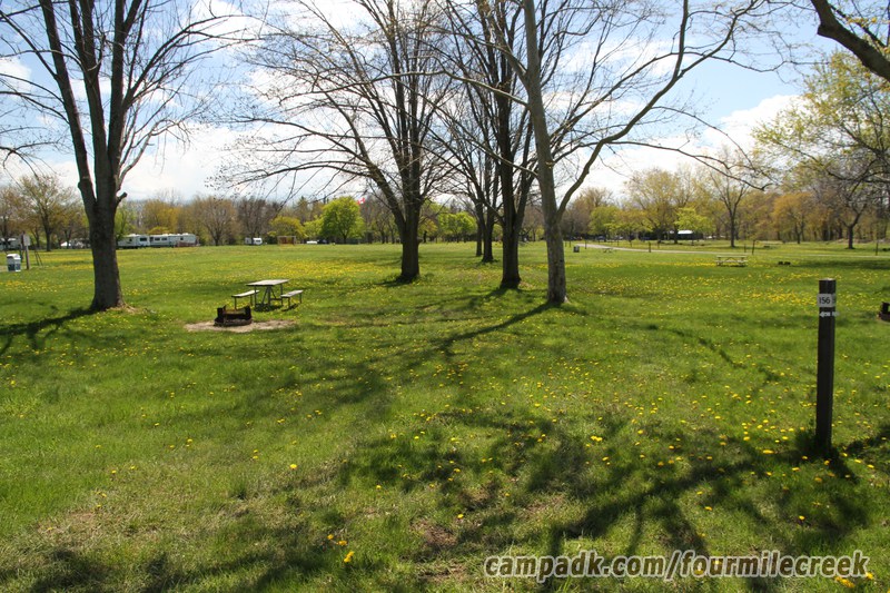 Campsite Photo of Site 156 at Four Mile Creek State Park, New York - Looking at Site from Road Sign Visible