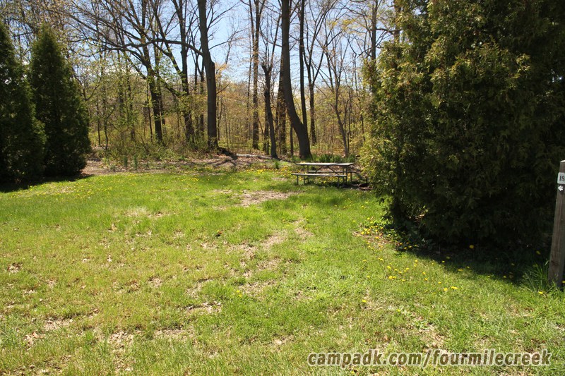 Campsite Photo of Site 180 at Four Mile Creek State Park, New York - Looking at Site from Road Sign Visible