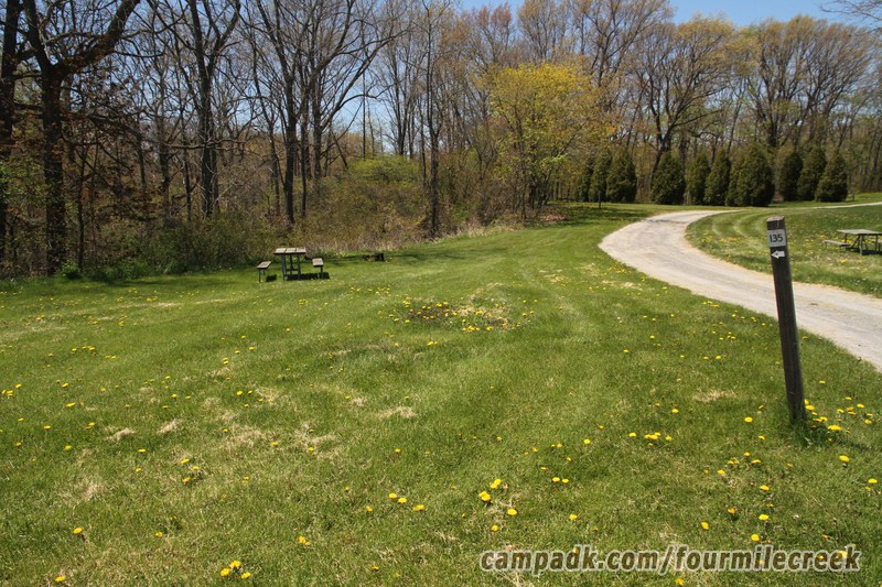Campsite Photo of Site 135 at Four Mile Creek State Park, New York - Looking at Site from Road Sign Visible