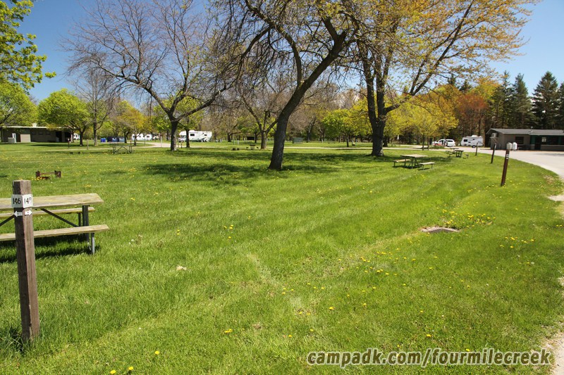 Campsite Photo of Site 148 at Four Mile Creek State Park, New York - Looking at Site from Road Sign Visible