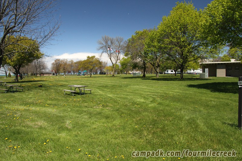 Campsite Photo of Site 120 at Four Mile Creek State Park, New York - Looking at Site from Road Sign Visible