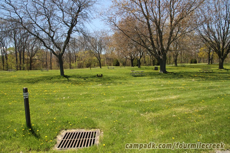Campsite Photo of Site 105 at Four Mile Creek State Park, New York - Looking at Site from Road Sign Visible