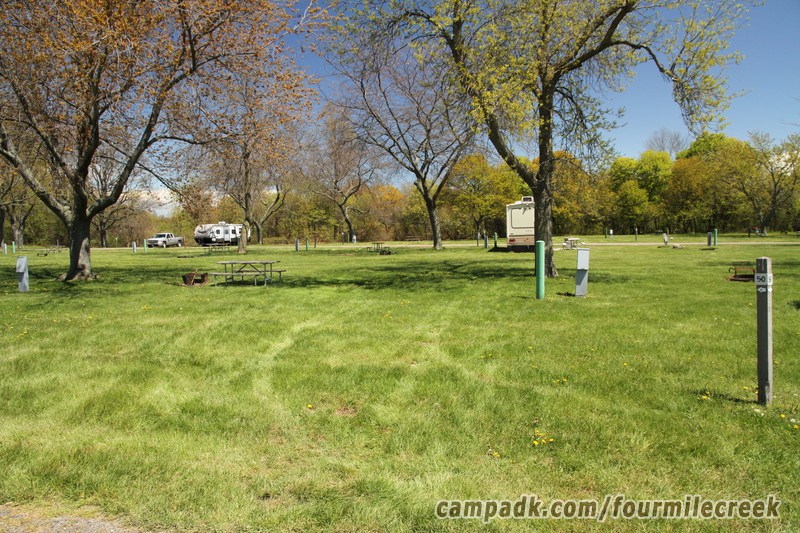 Campsite Photo of Site 50 at Four Mile Creek State Park, New York - Looking at Site from Road Sign Visible