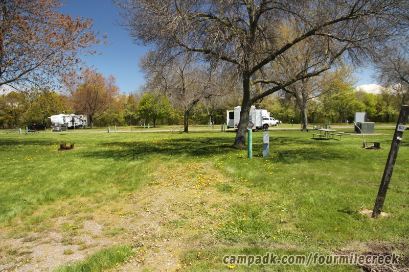 Campsite Photo of Site 60 at Four Mile Creek State Park, New York - Looking at Site from Road Sign Visible