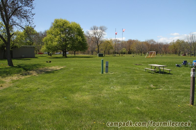 Campsite Photo of Site 65 at Four Mile Creek State Park, New York - Looking at Site from Road Sign Visible