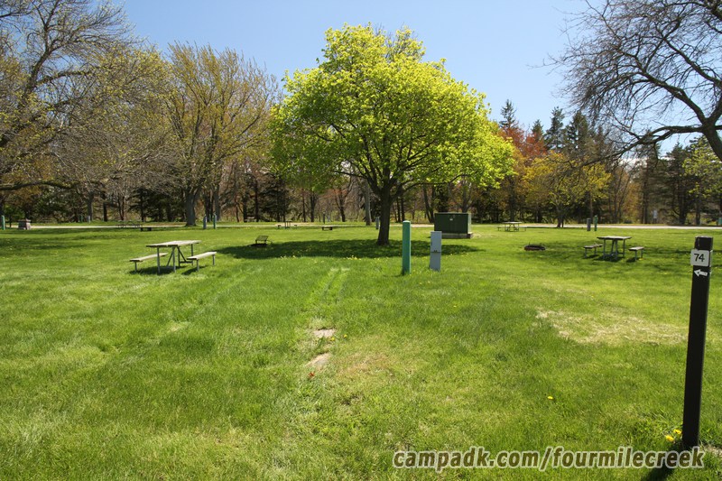 Campsite Photo of Site 74 at Four Mile Creek State Park, New York - Looking at Site from Road Sign Visible