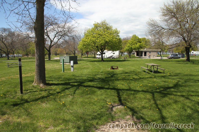 Campsite Photo of Site 6 at Four Mile Creek State Park, New York - Looking at Site from Road Sign Visible