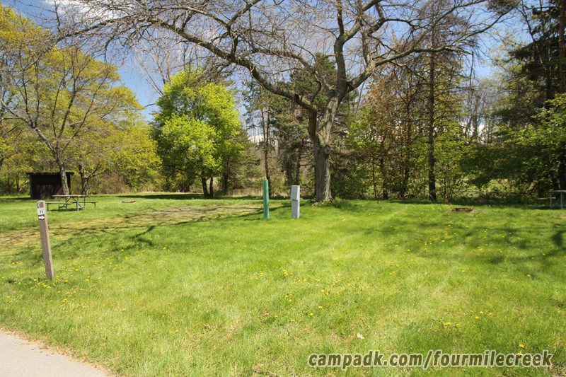 Campsite Photo of Site 11 at Four Mile Creek State Park, New York - Looking at Site from Road Sign Visible