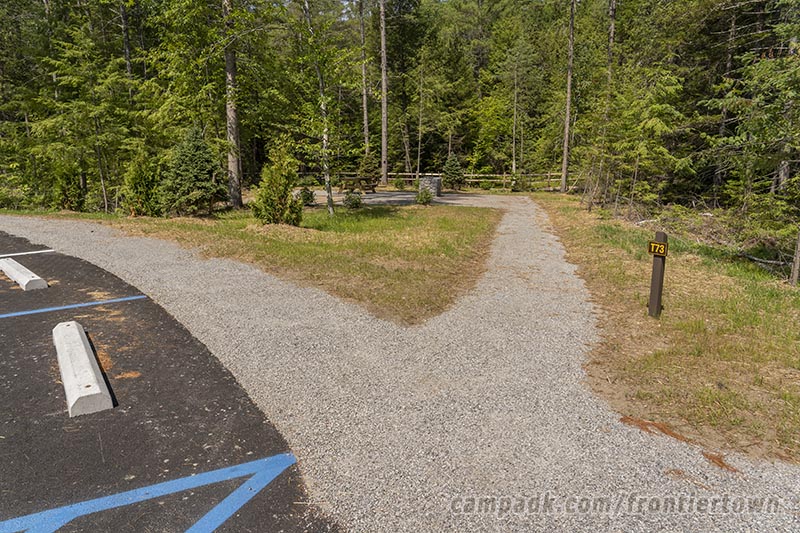 Campsite Photo of Site T73 at Frontier Town Campground, New York - Looking at Site from Road Sign Visible