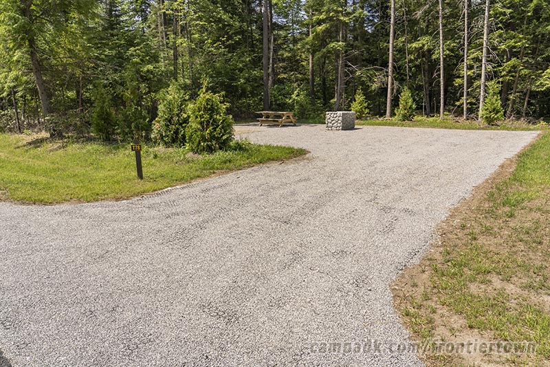 Campsite Photo of Site T78 at Frontier Town Campground, New York - Looking at Site from Road Sign Visible