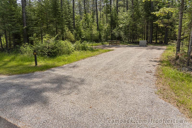 Campsite Photo of Site T88 at Frontier Town Campground, New York - Looking at Site from Road Sign Visible
