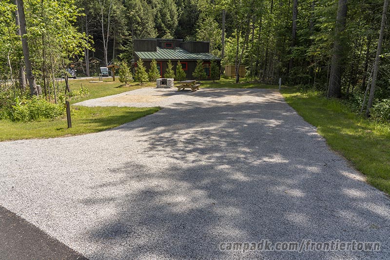 Campsite Photo of Site R35 at Frontier Town Campground, New York - Looking at Site from Road Sign Visible