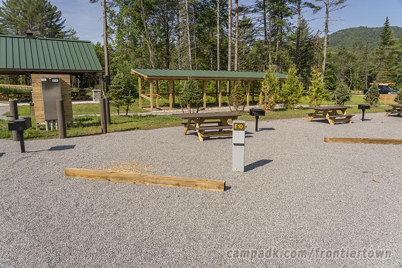 Campsite Photo of Site E10 at Frontier Town Campground, New York - Looking at Site from Road Sign Visible