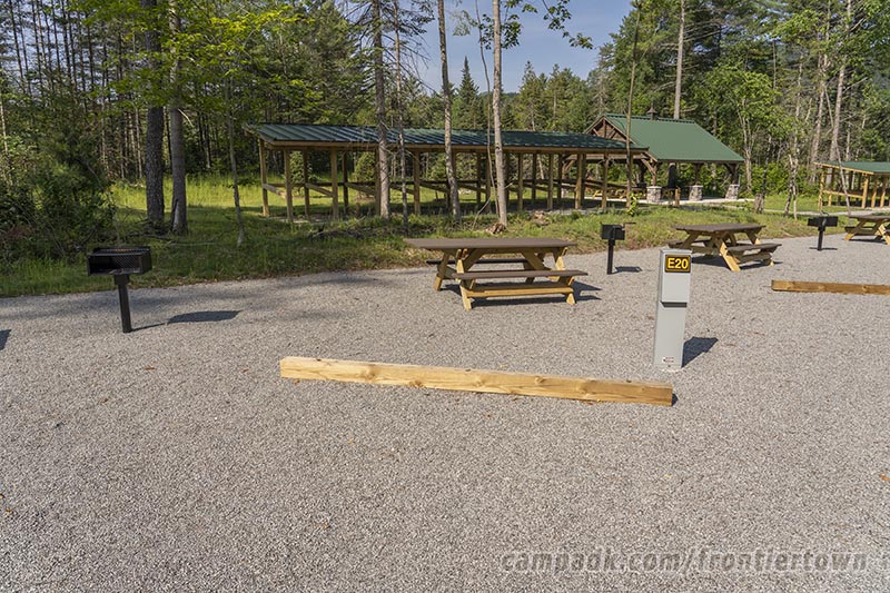 Campsite Photo of Site E20 at Frontier Town Campground, New York - Looking at Site from Road Sign Visible