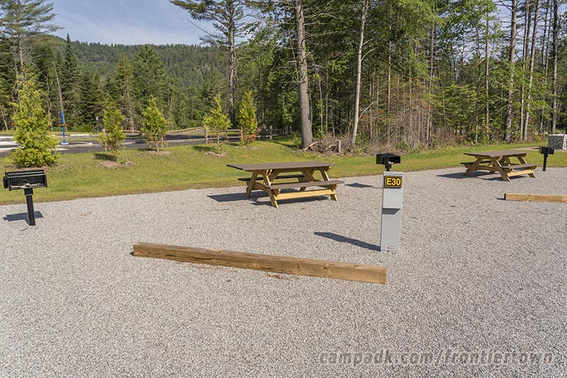 Campsite Photo of Site E30 at Frontier Town Campground, New York - Looking at Site from Road Sign Visible