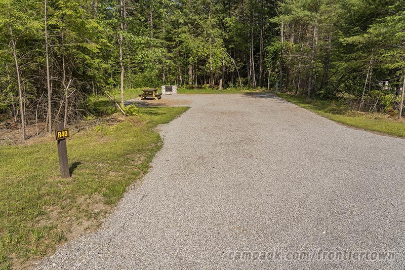 Campsite Photo of Site R40 at Frontier Town Campground, New York - Looking at Site from Road Sign Visible