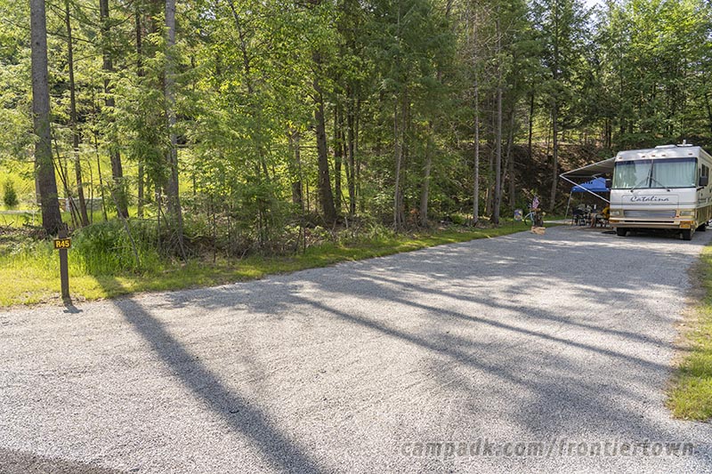 Campsite Photo of Site R45 at Frontier Town Campground, New York - Looking at Site from Road Sign Visible