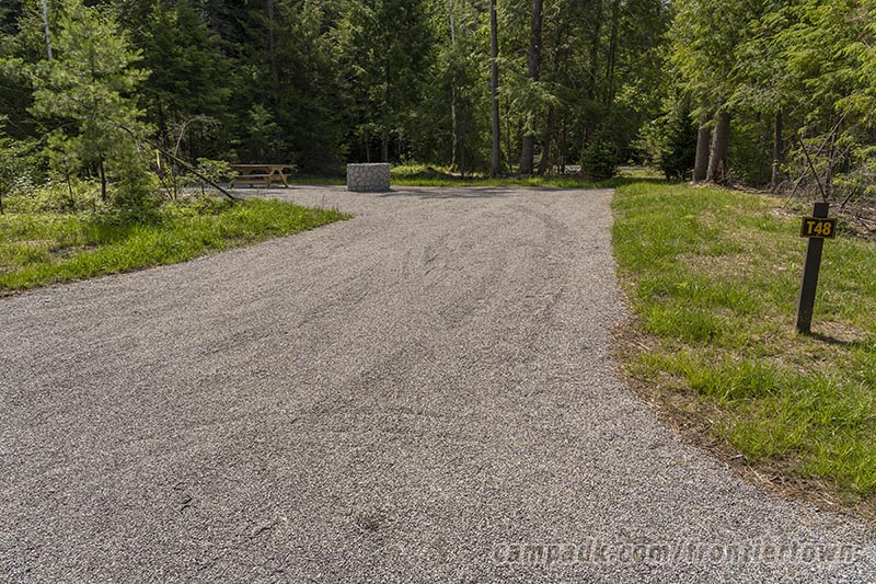 Campsite Photo of Site T48 at Frontier Town Campground, New York - Looking at Site from Road Sign Visible