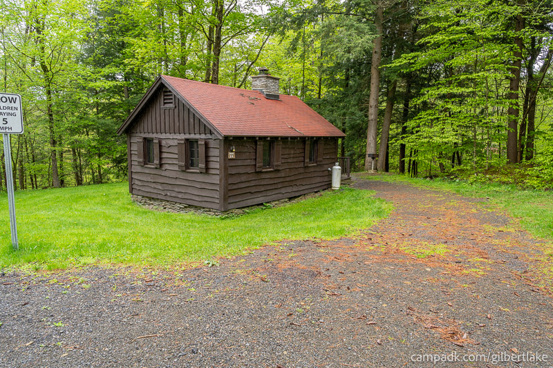 Campsite Photo of Site 24 at Gilbert Lake State Park, New York - Looking at Site from Road Sign Visible