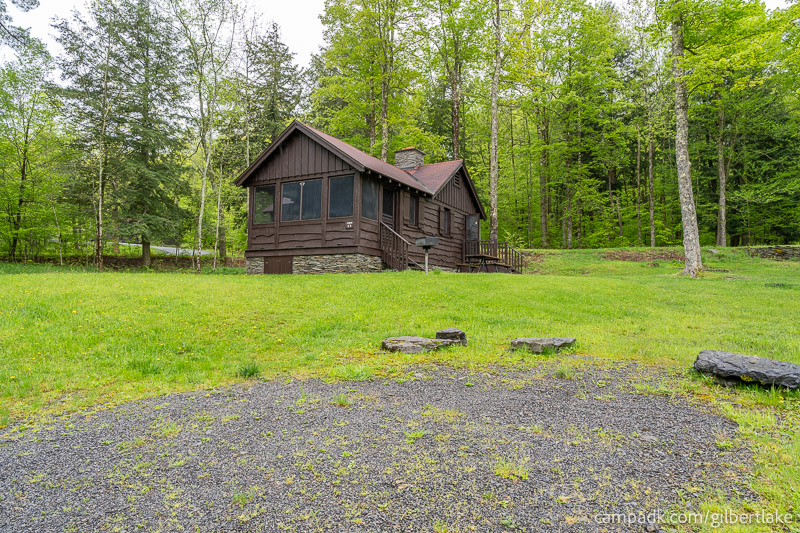 Campsite Photo of Site 25 at Gilbert Lake State Park, New York - Looking at Site from Road Sign Visible