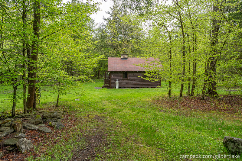 Campsite Photo of Site 14 at Gilbert Lake State Park, New York - Looking at Site from Road Sign Visible