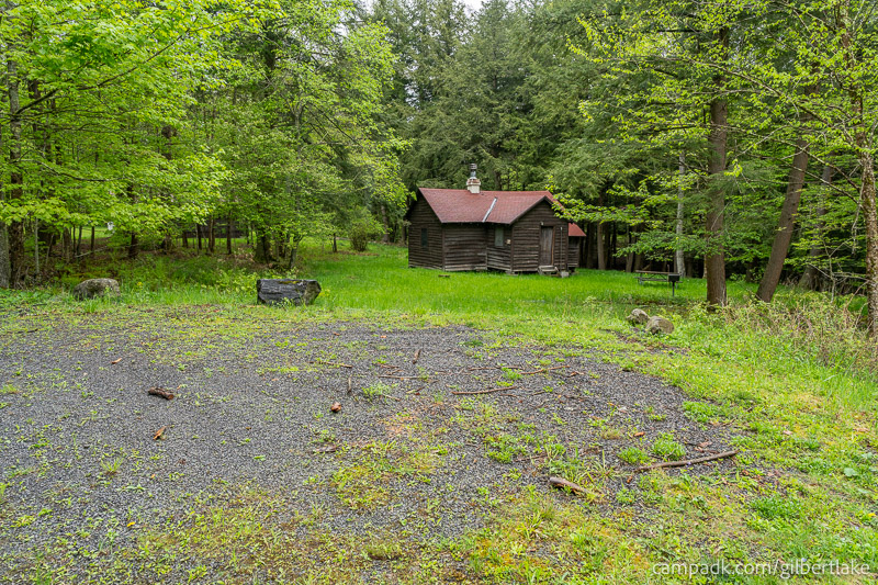 Campsite Photo of Site 11 at Gilbert Lake State Park, New York - Looking at Site from Road Sign Visible