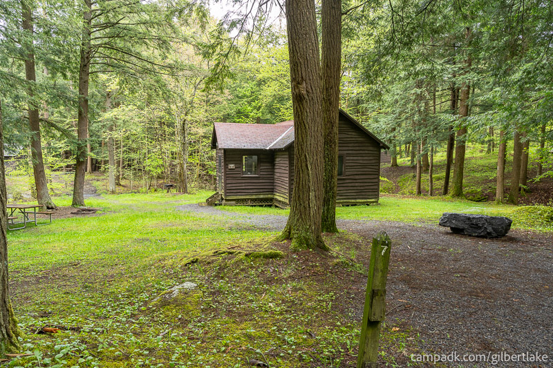 Campsite Photo of Site 7 at Gilbert Lake State Park, New York - Looking at Site from Road Sign Visible