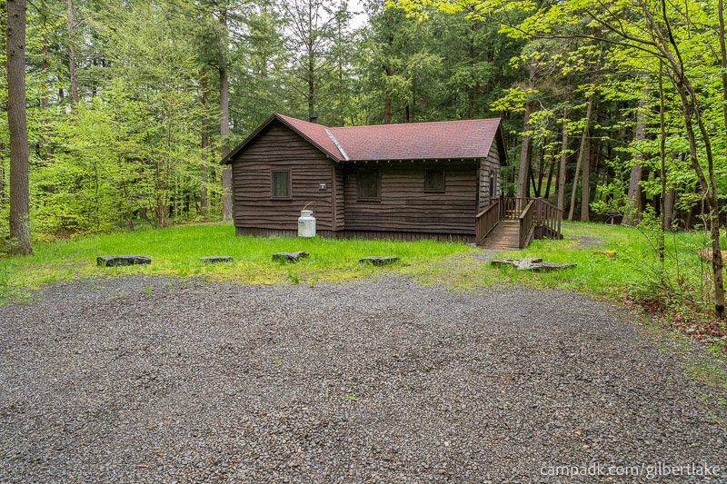 Campsite Photo of Site 5 at Gilbert Lake State Park, New York - Looking at Site from Road Sign Visible