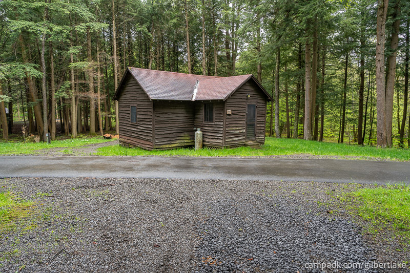 Campsite Photo of Site 4 at Gilbert Lake State Park, New York - Looking at Site from Road Sign Visible