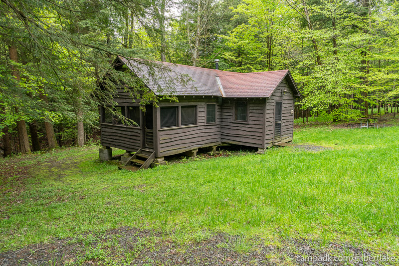 Campsite Photo of Site 1 at Gilbert Lake State Park, New York - Looking at Site from Road Sign Visible