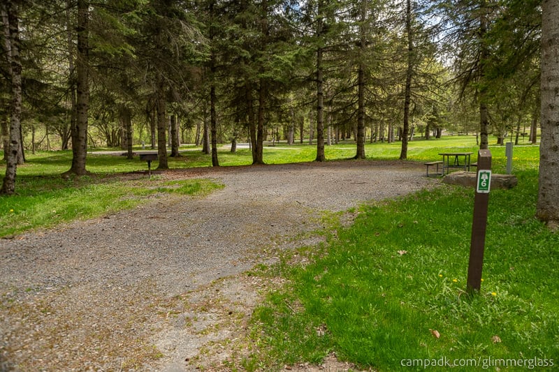 Campsite Photo of Site 6 at Glimmerglass State Park, New York - Looking at Site from Road Sign Visible