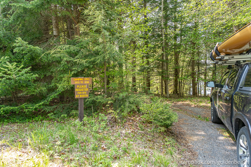 Campsite Photo of Site 204 at Golden Beach Campground, New York - Looking at Site from Road Sign Visible