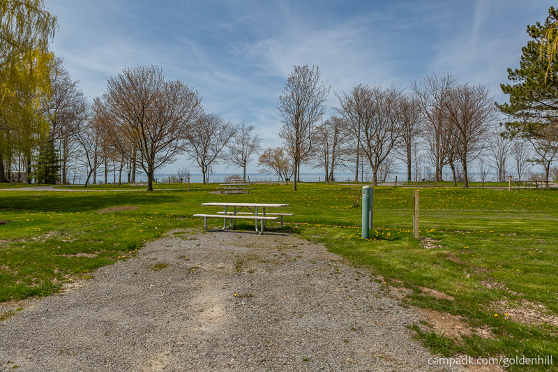Campsite Photo of Site 55 at Golden Hill State Park, New York - Looking at Site from Road Sign Visible