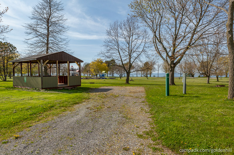 Campsite Photo of Site 21 at Golden Hill State Park, New York - Looking at Site from Road Sign Visible