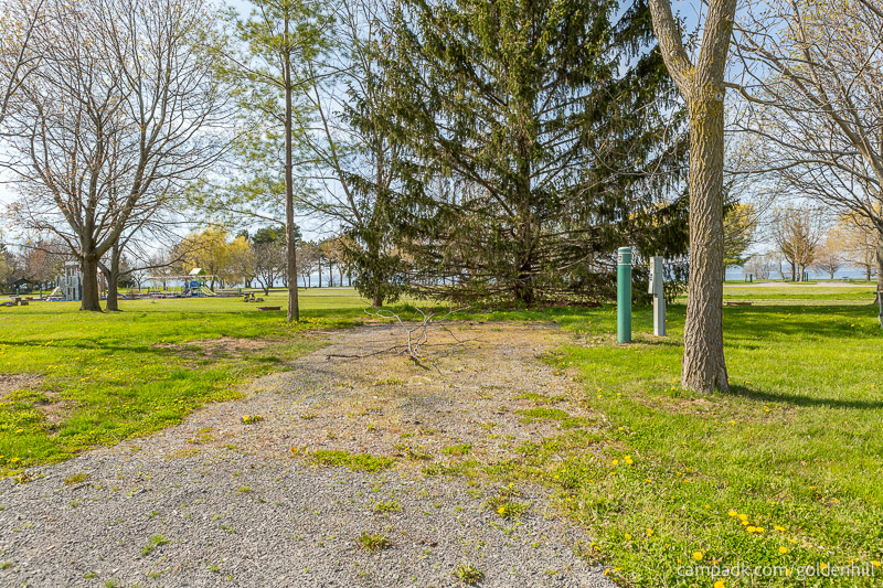 Campsite Photo of Site 22 at Golden Hill State Park, New York - Looking at Site from Road Sign Visible
