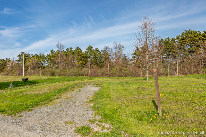 Campsite Photo of Site 26 at Golden Hill State Park, New York - Looking at Site from Road Sign Visible