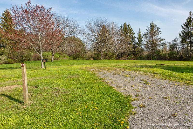 Campsite Photo of Site 27 at Golden Hill State Park, New York - Looking at Site from Road Sign Visible