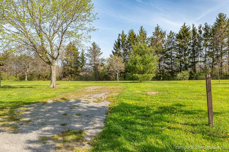 Campsite Photo of Site 28 at Golden Hill State Park, New York - Looking at Site from Road Sign Visible