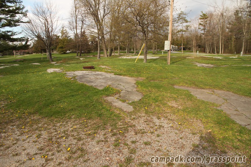 Campsite Photo of Site 76 at Grass Point State Park, New York - Looking at Site from Road Sign Visible