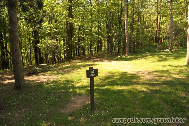 Campsite Photo of Site 86 at Green Lakes State Park, New York - Looking at Site from Road Sign Visible