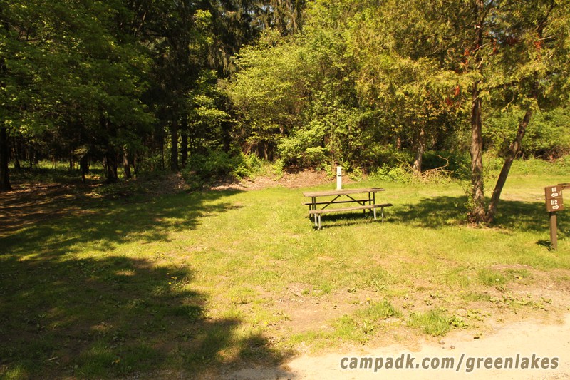 Campsite Photo of Site 111 at Green Lakes State Park, New York - Looking at Site from Road Sign Visible