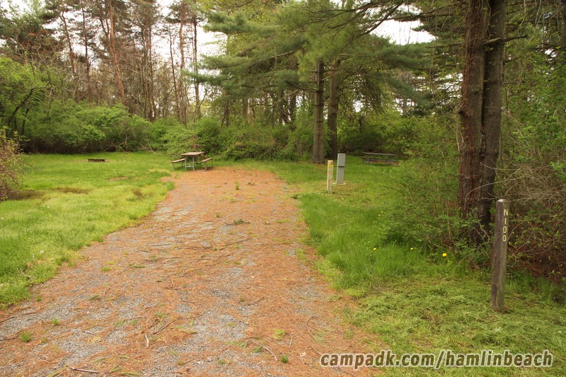 Campsite Photo of Site 100 at Hamlin Beach State Park, New York - Looking at Site from Road Sign Visible