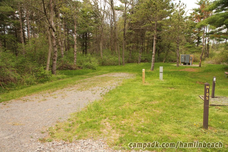 Campsite Photo of Site 105 at Hamlin Beach State Park, New York - Looking at Site from Road Sign Visible